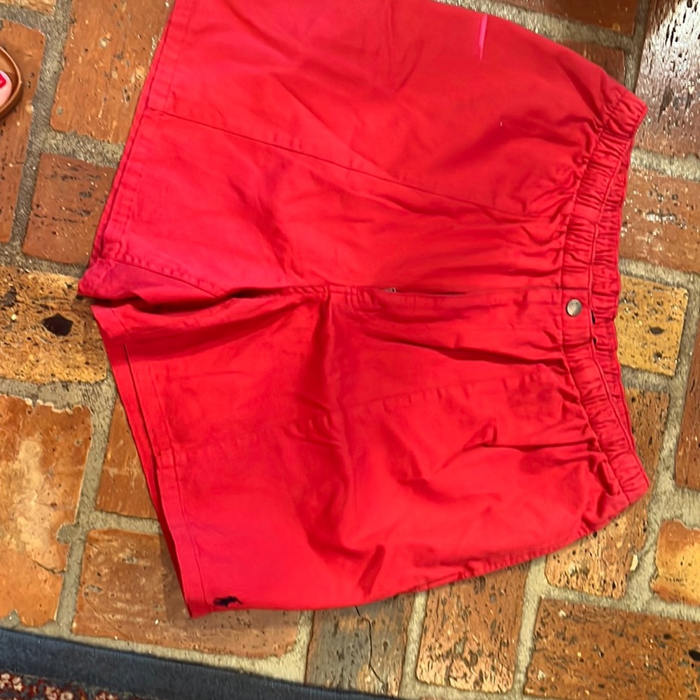 Men’s red polo shorts with elastic waist. Size XL